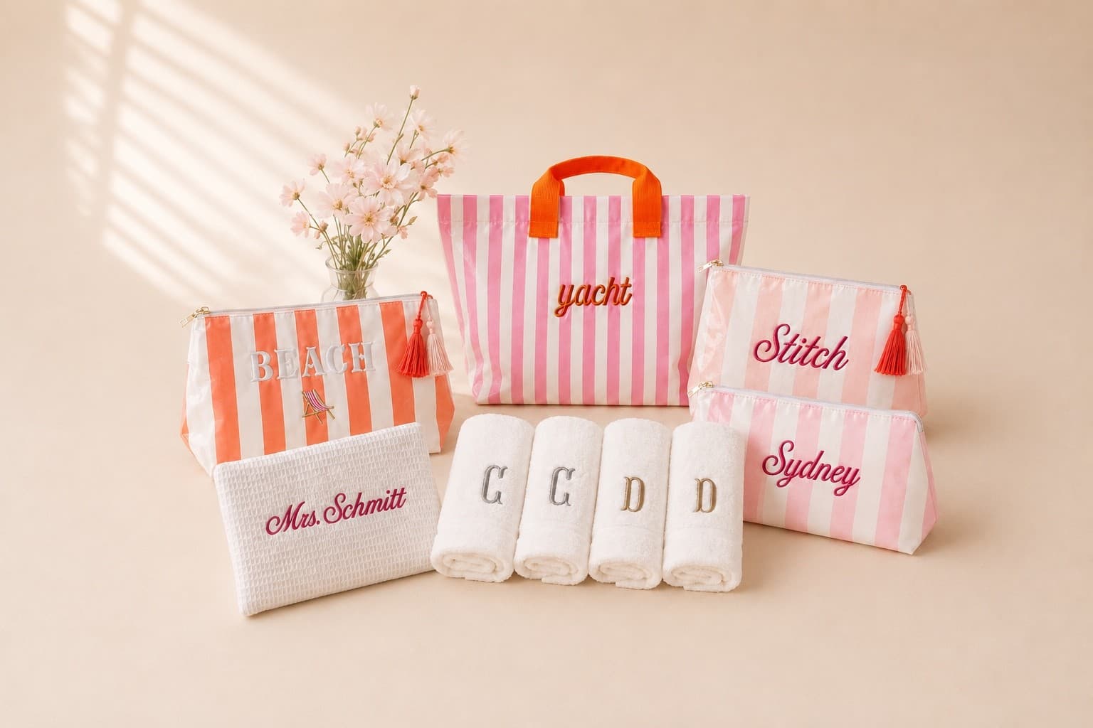 Canvas tote, folded crewneck, waffle pouch, hand towel, and bath towel with distinct three-letter monograms